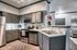 Modern kitchen with sleek stainless steel appliances, elegant cabinetry, and stylish backsplash, offering a blend of functionality and contemporary design.
