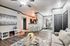 Chic open-concept living room with modern decor, cozy fireplace, and elegant dining area, perfect for stylish urban living.