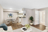 Inviting open-concept living area with modern kitchen, elegant dining space, and chic decor, perfect for stylish city living.