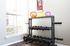Bright home gym corner with vibrant kettlebells and sleek dumbbell rack by a sunlit window.