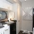 Cozy kitchen corner with modern decor, featuring sleek countertops, elegant wall art, and inviting home accents.