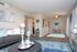 Inviting living and dining area featuring modern decor, cozy seating, and elegant accents, perfect for relaxed entertaining.