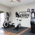 Inviting home gym with modern exercise bikes and motivational wall art.