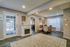 Inviting living space with soft lighting, elegant fireplace, and cozy seating area, perfect for relaxation and comfort.