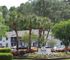 Charming exterior view of Hunters Pointe Apartment Homes surrounded by lush greenery and vibrant landscaping.