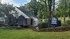 Charming apartment complex with lush landscaping and inviting facade at The Villages.