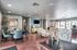 Modern and inviting common area featuring stylish seating, vibrant decor, and ample natural light perfect for gatherings.