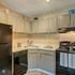 Charming modern kitchen with sleek cabinetry, stylish decor, and contemporary appliances creating a welcoming atmosphere.