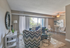 Bright and inviting living room with modern decor, large window views, and cozy seating arrangement for relaxation.