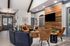 Inviting living room with a modern touch, featuring cozy plush seating, a stylish wooden accent wall, and elegant lighting.