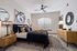 Elegant bedroom design featuring a luxurious bed with plush pillows, stylish wooden furniture, and modern decor under warm ambient lighting.