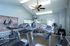Contemporary apartment gym featuring modern cardio equipment, including treadmills and stationary bikes, in a well-lit, stylish setting.