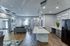 Elegant open-concept living space with sleek kitchen island, modern decor, and abundant natural light.