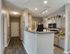 Chic and modern kitchen featuring sleek cabinetry, granite countertops, and vibrant decor for a warm ambiance.
