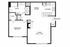 Inviting floor plan featuring a spacious bedroom, modern kitchen with dining area, and a large living room with a cozy bookcase nook.