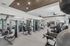 Modern fitness center equipped with state-of-the-art exercise machines, weightlifting equipment, and ample space for workouts.