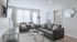 Bright and modern living room with sleek gray seating, stylish decor, and large windows for natural light.