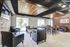 Inviting lounge area with modern decor, featuring stylish leather seating, warm wood accents, and large windows for natural light.