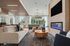 Luxurious modern living room with elegant sofas, stylish decor, ambient lighting, and a sleek fireplace, offering a cozy and inviting atmosphere.