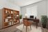 Modern home office with a sleek wooden desk, comfortable leather chair, stylish bookshelf, and vibrant greenery creating a productive workspace.