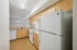 Modern kitchen with sleek appliances, bright cabinetry, and ample counter space.