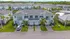 Elegant townhouse community with modern architecture, lush green surroundings, and ample parking. Ideal for family living.
