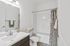 Elegant bathroom with modern fixtures, sleek vanity, and calming neutral decor.