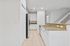 Bright and modern kitchen with sleek granite countertops, stainless steel appliances, and elegant cabinetry, ideal for culinary enthusiasts.