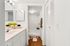 Chic bathroom with modern fixtures, bright lighting, and charming decor, featuring a stylish vanity and spacious shower.