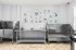 Chic pet grooming station featuring stainless steel tubs and colorful dog artwork, perfect for pet-friendly households.