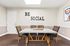 Inviting social area with elegant table and chairs, surrounded by inspiring decor and modern design elements.