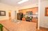 Elegant kitchen with sleek countertops, modern appliances, and warm wood cabinetry for a cozy home atmosphere.