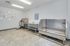 Modern pet spa area with stainless steel wash stations and charming dog-themed wall art.