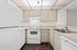 Bright kitchen with elegant cabinetry, modern appliances, and sleek countertops, ideal for culinary creativity.