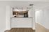 Contemporary kitchen with sleek wooden cabinetry, spacious countertops, and elegant lighting enhancing modern living.