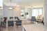 Modern open-concept apartment with a sleek dining area, stylish living room, and abundant natural light.