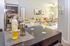 Chic modern apartment showcasing an open-concept living area with stylish decor, cozy seating, and elegant kitchen setup.
