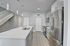 Sleek modern kitchen featuring stainless steel appliances, elegant quartz countertops, and stylish pendant lighting.