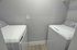 Sleek and modern laundry room with energy-efficient washer and dryer, perfect for convenient living.