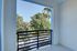 Serene balcony view with lush greenery, perfect for relaxation and enjoying nature.