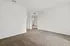 Bright and spacious unfurnished room with soft carpet and a door leading to an adjacent hallway, perfect for personalized design.