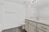 Sleek and modern bathroom with elegant countertops, stylish fixtures, and pristine finishes.