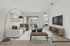 Inviting living room with stylish decor, modern furniture, and a view of the balcony; features a cozy sofa, chic coffee table, and wall-mounted TV, perfect for relaxation.