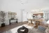 Bright and spacious open-concept living area with elegant modern decor, featuring a stylish kitchen, inviting dining space, and cozy lounge.