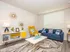 Bright and modern living room with a stylish blue sofa, vibrant yellow chair, chic decor, and elegant accents.