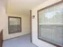 Inviting apartment patio with large windows, offering bright natural light and a cozy atmosphere.