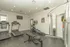 Modern fitness center with state-of-the-art equipment including treadmills, exercise bike, and weight machine.
