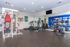 Modern fitness center with state-of-the-art equipment, vibrant decor, and ample space for workouts.
