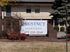 Cozy Chestnut Apartments with inviting exterior and beautifully landscaped entrance, offering a warm community atmosphere.