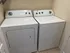Modern laundry room featuring a sleek washer and dryer set, providing convenience and style.